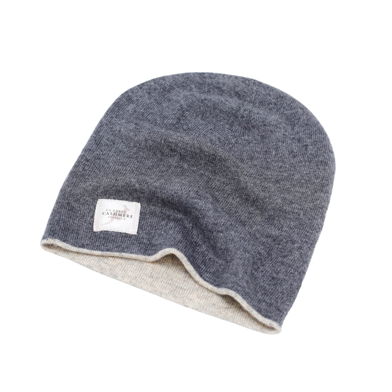 Gray knit beanie with a white label on a white background