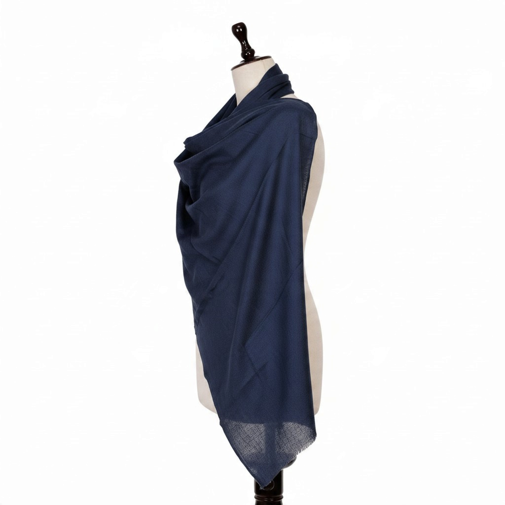 My Store navy blue lightweight 100% pure cashmere shawl draped elegantly on a mannequin for evening wear.